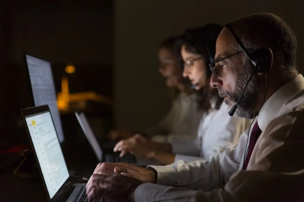 Why Smart People Only Choose Authorized Service Centers 1 focused coworkers headsets typing laptops 1